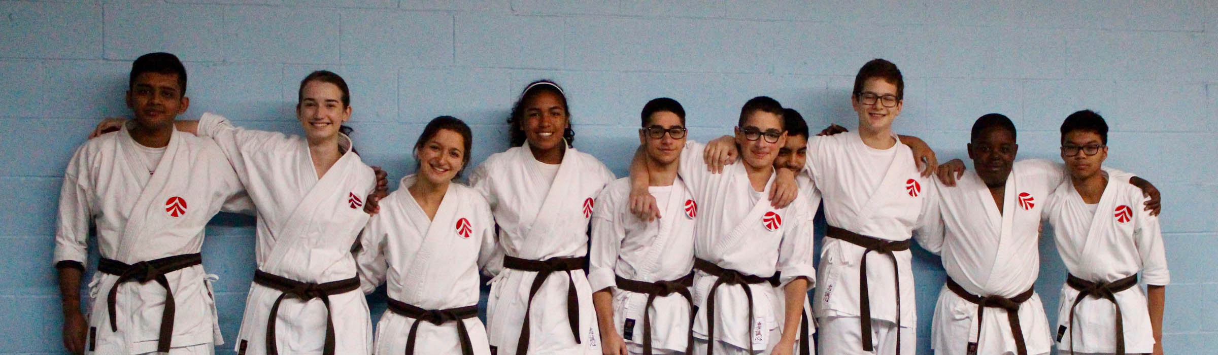 Top-Image-Miss-Team-1 AMA Karate Youth Team posing in white Gi's wearing black belts side by site