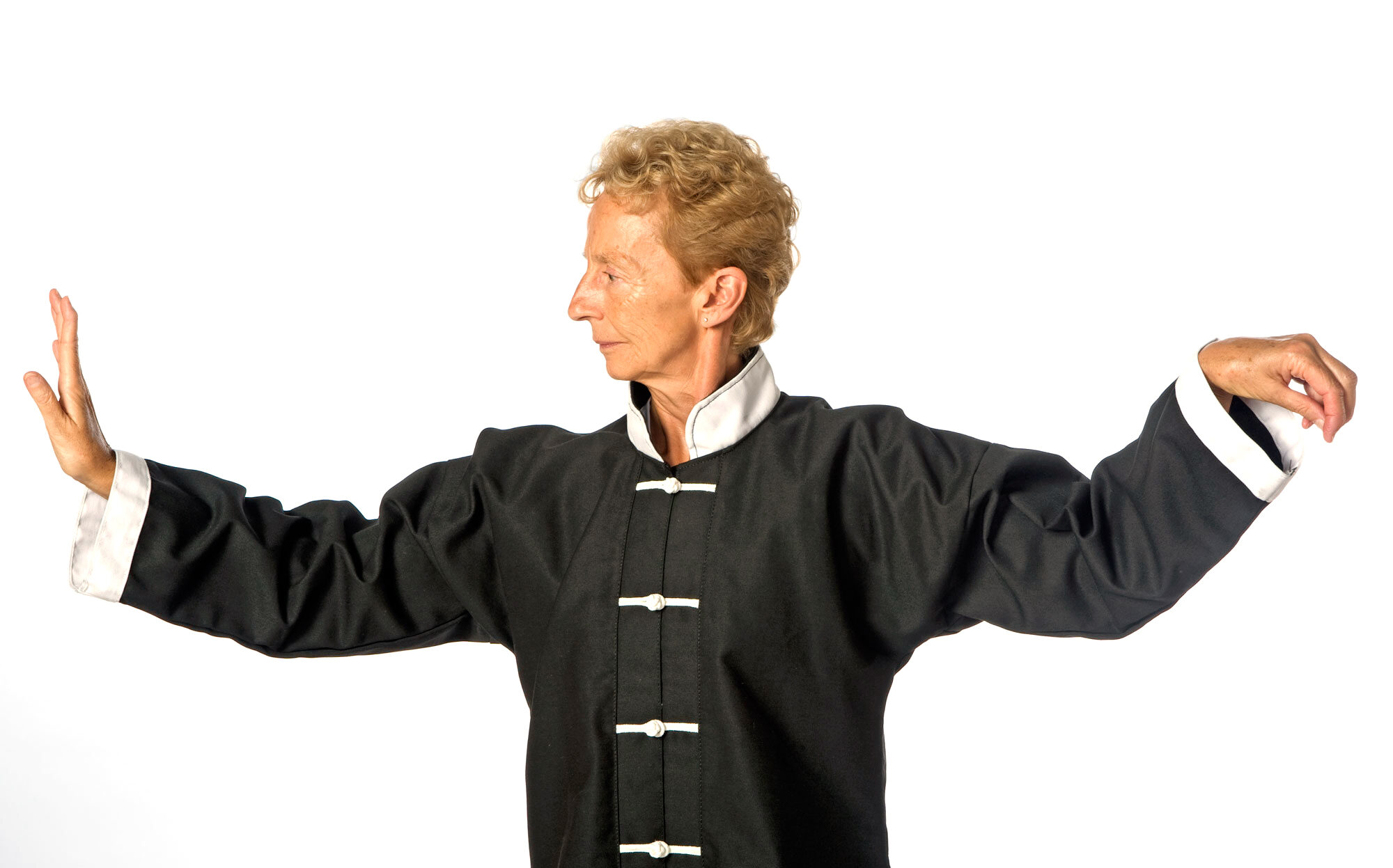 TaiChi_4 copy Tai Chi instructor in black uniform posing in a ready stance.