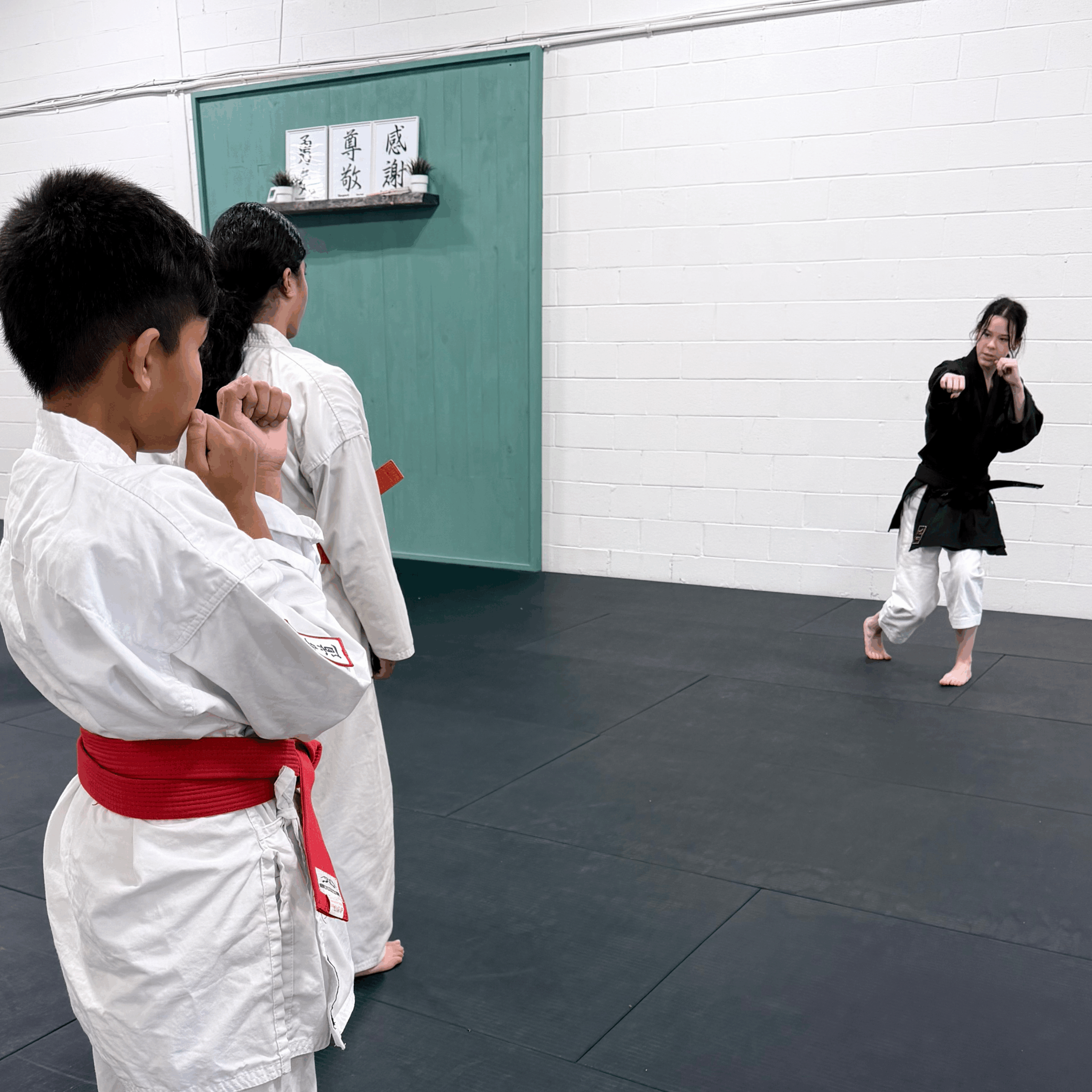 2 Two youth karate students working together on technique at AMA Dojo Mississauga.