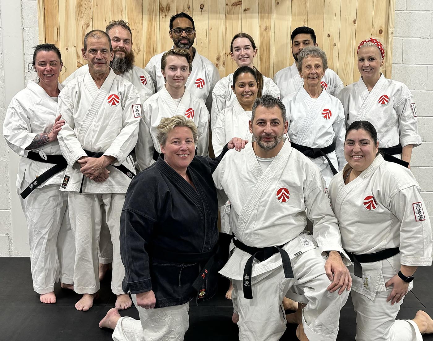 Teen karate group photo with black belt instructors after training at AMA Mississauga.