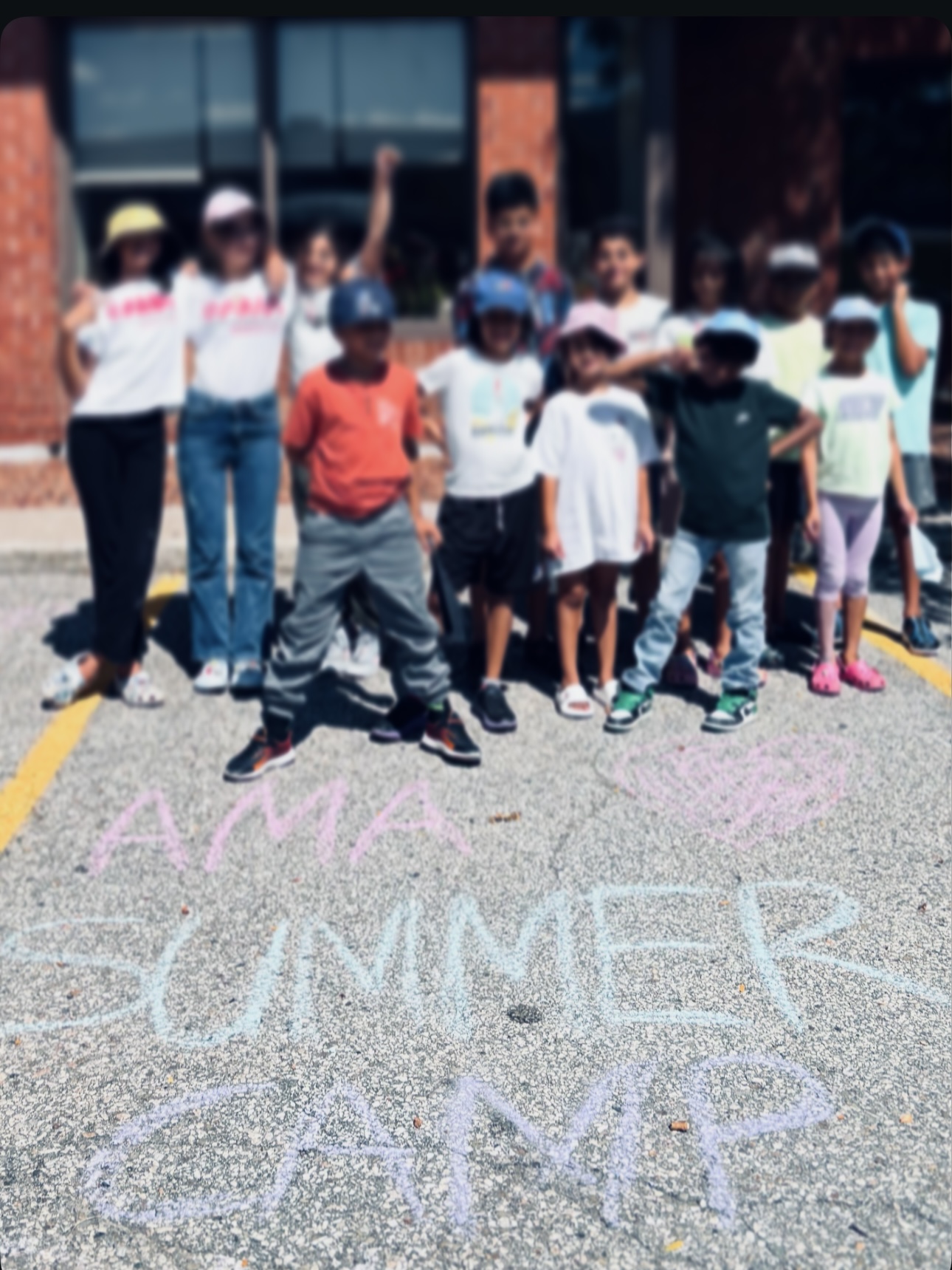 Screenshot AMA Dojo, Summer Karate Camp Kids outside the front of the Dojo in a group waving happily.